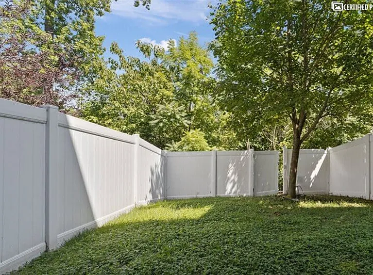Gated yard backs up to deer populated forest and pond.