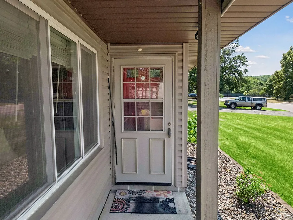 Private covered entry with well-maintained landscaping.