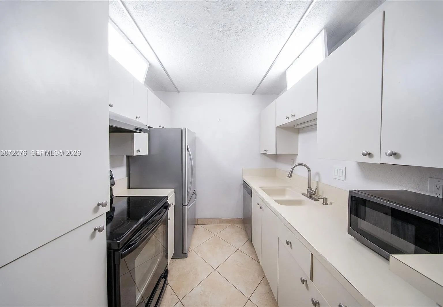 Spanish Trace Condo — Photo 1