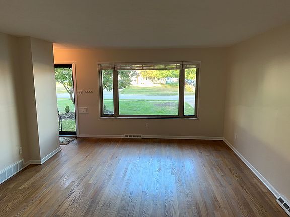 Front entrance to large gathering room. Living Room and Dining Room. Off kitchen.