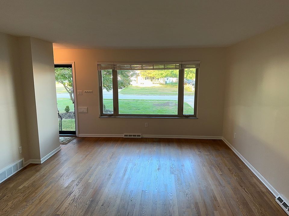 Front entrance to large gathering room. Living Room and Dining Room. Off kitchen.