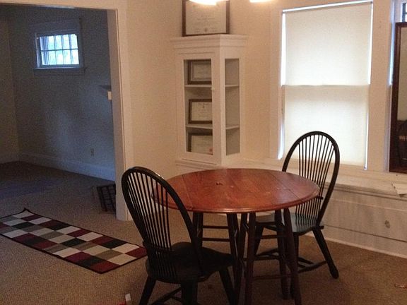 dining room with original built in cabinets and bench