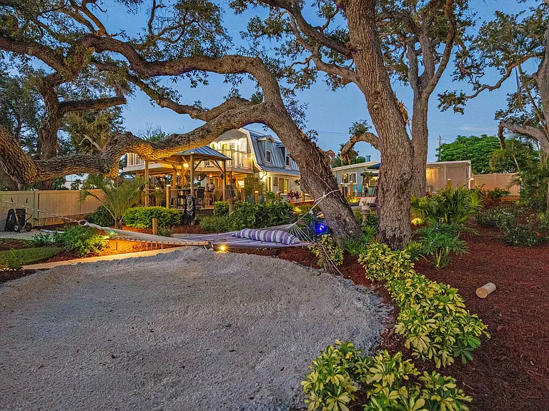 SANDY BEACH AREA WITH HAMMOCK UNDER MASSIVE OAKS