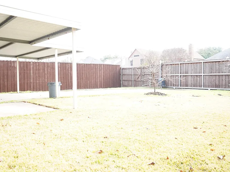 Sliding electric gate for additional privacy.
