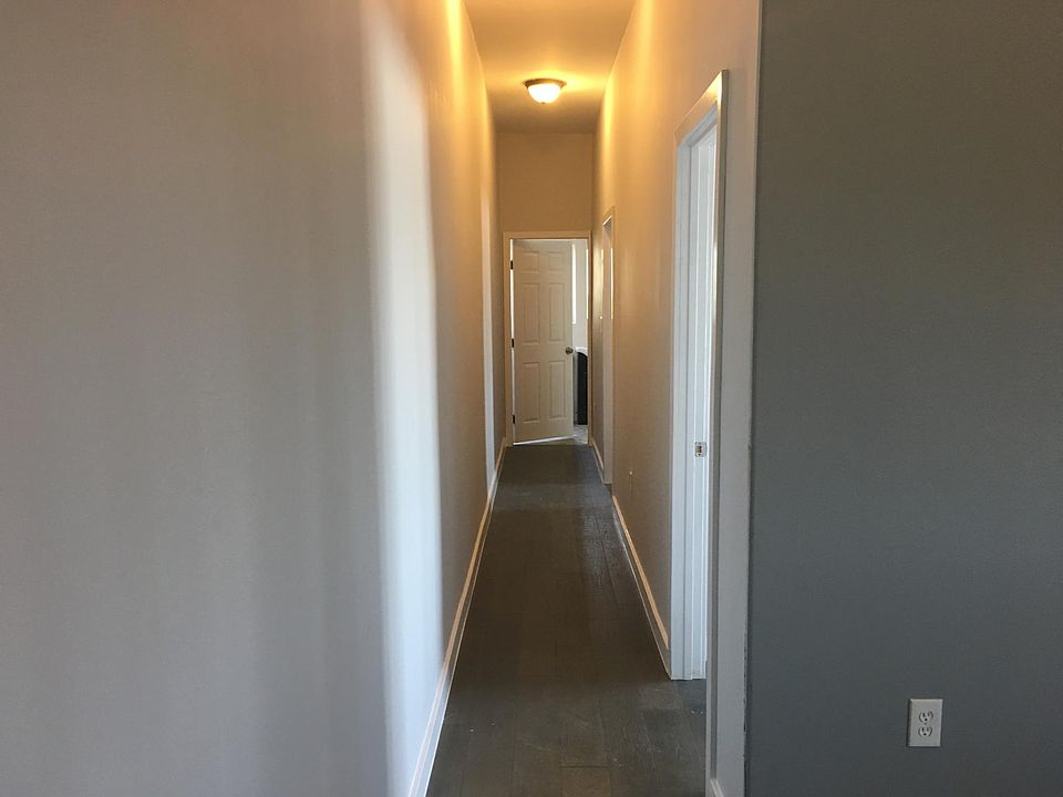 Hallway to bedrooms and bathroom.