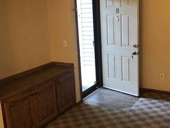 View from dining area/built in credenza and front door.