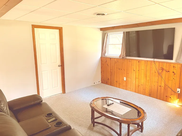 Living room#2 downstairs (closed door to laundry and 1/2 bathroom on your left)