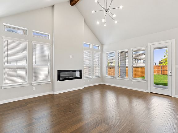 Living room in the Denali home plan by Trophy Signature Homes - REPRESENTATIVE PHOTO