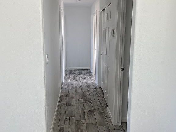 Hallway to three bedrooms 
