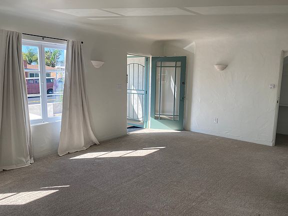 Front entrance opens into a spacious, airy living area.