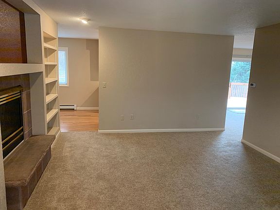 Living room with family room to the right, and dining in back