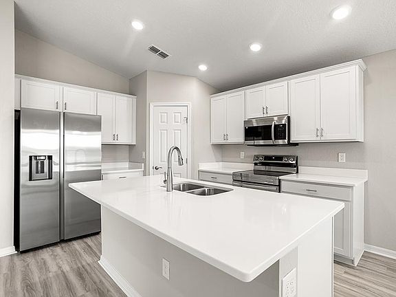 Your new kitchen is bright, beautiful, and functional - Sophia by Highland Homes