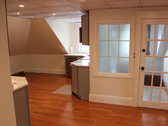 Partial views of open kitchen .cabinetry quartz counters
