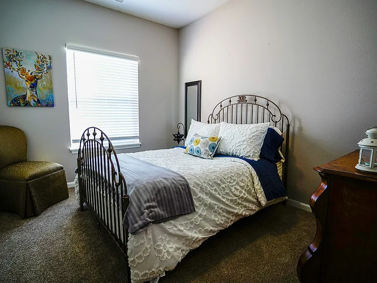 A bright, versatile secondary bedroom at The Bristol offers plenty of space to relax, work, or welcome guests _ complete with large windows and modern touches.
