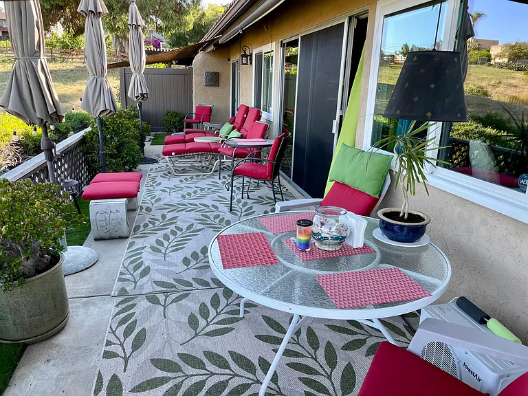 Back patio with umbrellas