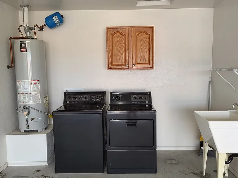 washer, dryer, sink and cabinets