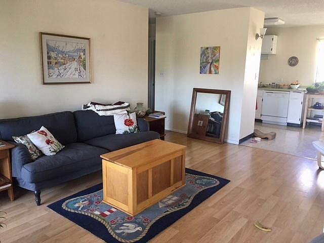 Well hello! Wide open, bright and charming living, dining and kitchen (view from entry). Kitchen is east facing, living room sliders, west facing.
