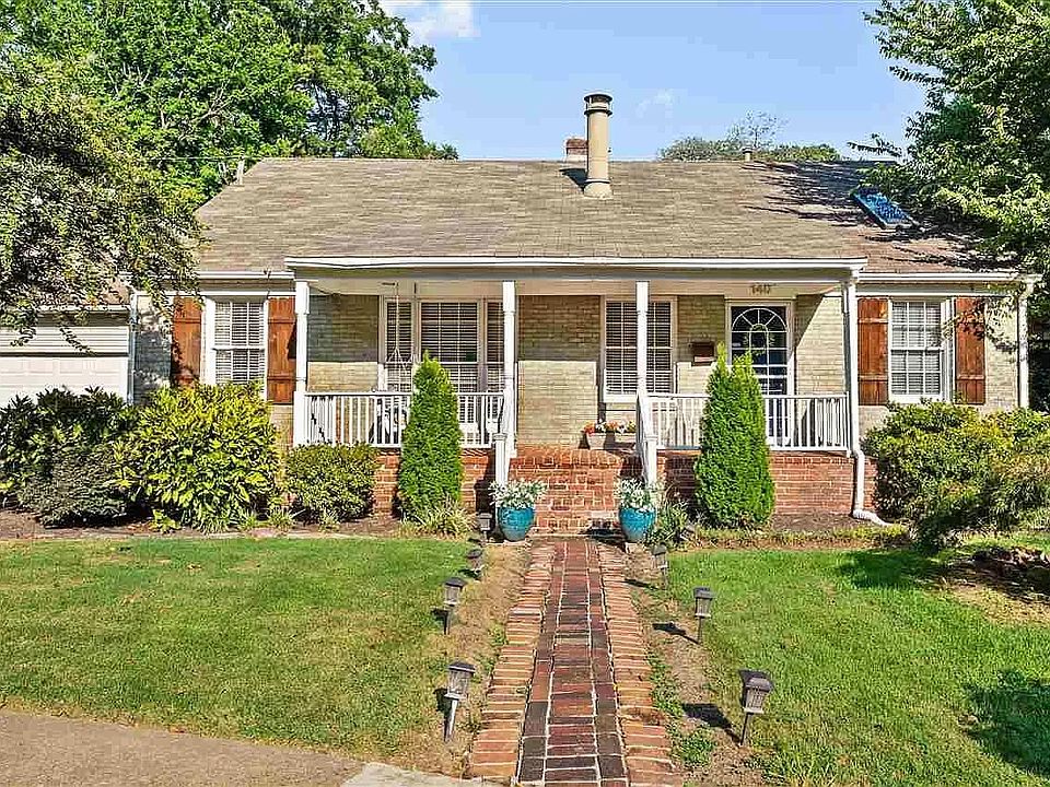 Beautiful brick walk way leading to the front of the house.