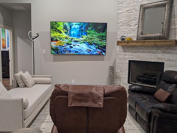 This room has perfect acoustics to enjoy a movie.