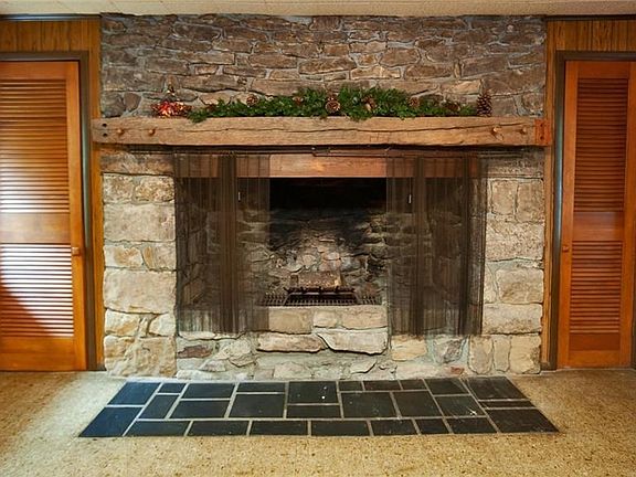 Beautiful stone fireplace is the focal point of this family room.