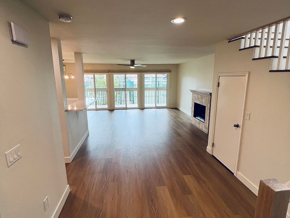 Entry into unit from front door with large storage space under stairs
