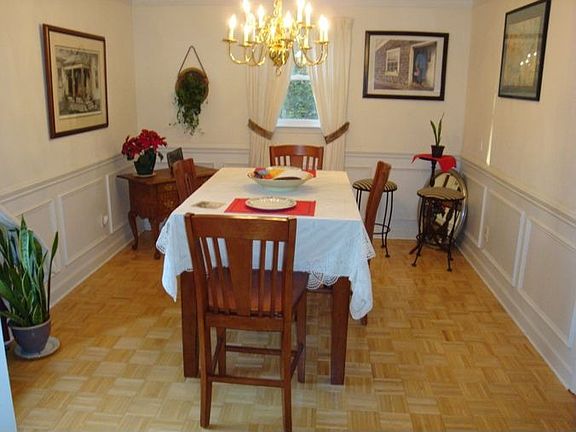 Formal Dining Room with Hardwoods, Crown, Picture, and Chair Moldings