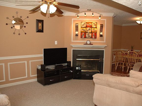 Living room with wood burning fireplace