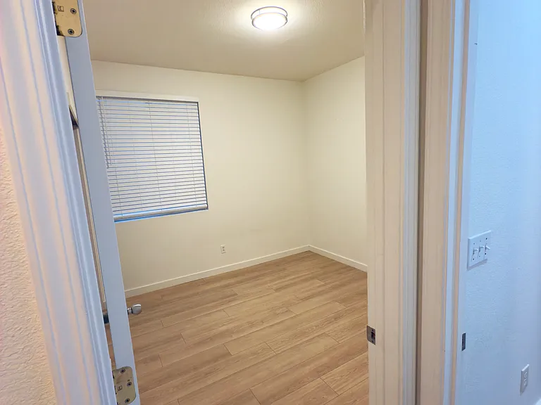 Room 3: A cozy and functional bedroom, filled with natural light, offering a comfortable space for relaxation.