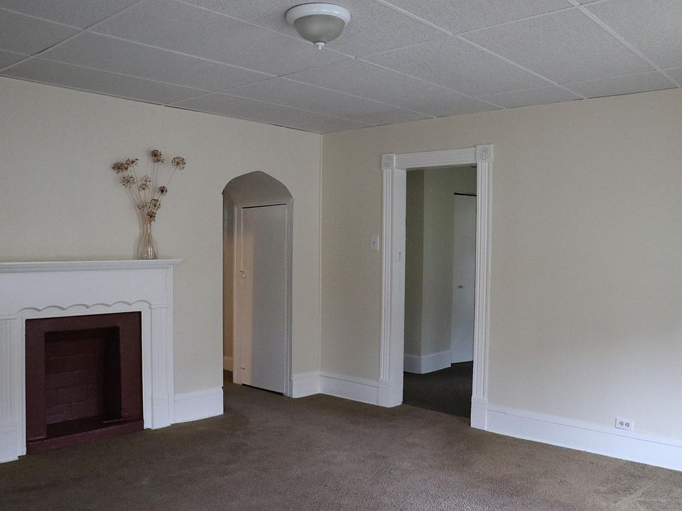 Living room with door to second bedroom, and hallway