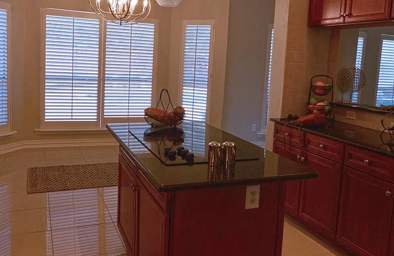 Beautiful view from the kitchen through the custom plantation shutters