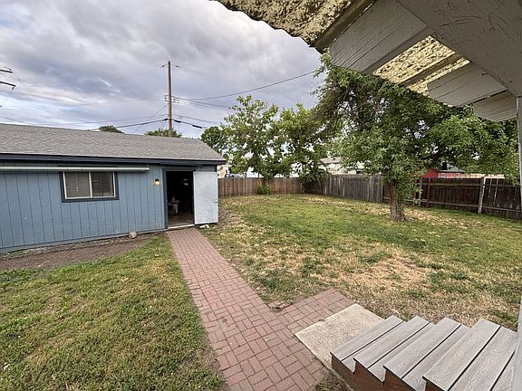 Backyard with entrance to garage