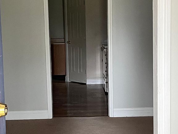 Beautiful living room right off from entry hallway and covered front porch.