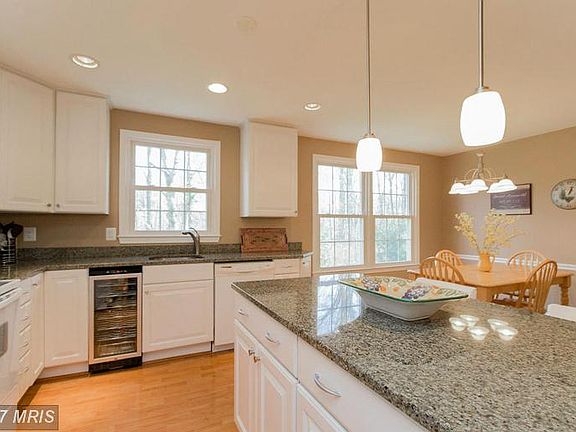 Beautiful granite and wine cooler conveys