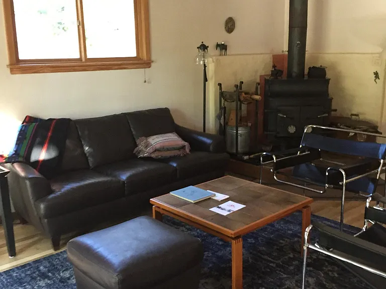 Living room has a wood stove