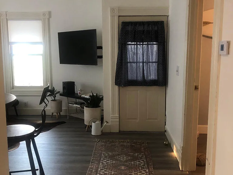 Entry way, with front room to left and second bedroom to right