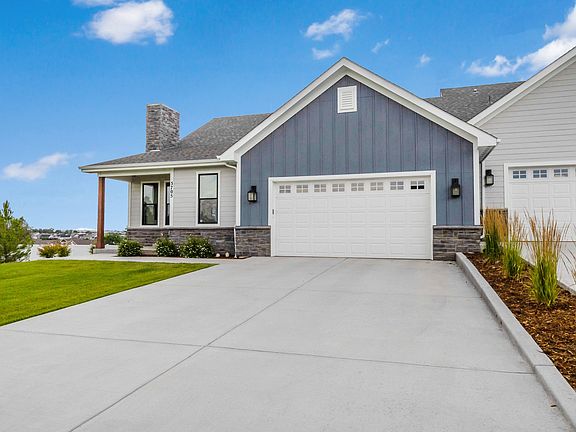 Notice the size of the driveway providing plenty of parking for family and friends. The best part is you don't have to shovel the snow