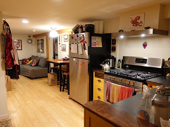 The kitchen is equipped with high-end appliances, including a dishwasher, and a gas range.