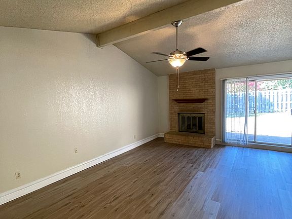 Family room with brand new plank flooring and paint