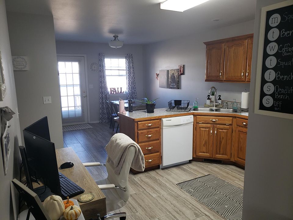 Kitchen and dining area, beautiful tile, light grey paint, LED lighting. New counter tops.