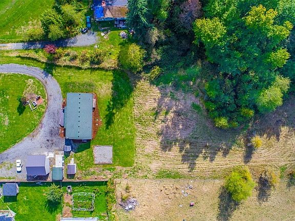 Great view showing the circular driveway and some of the 2 plus acres.