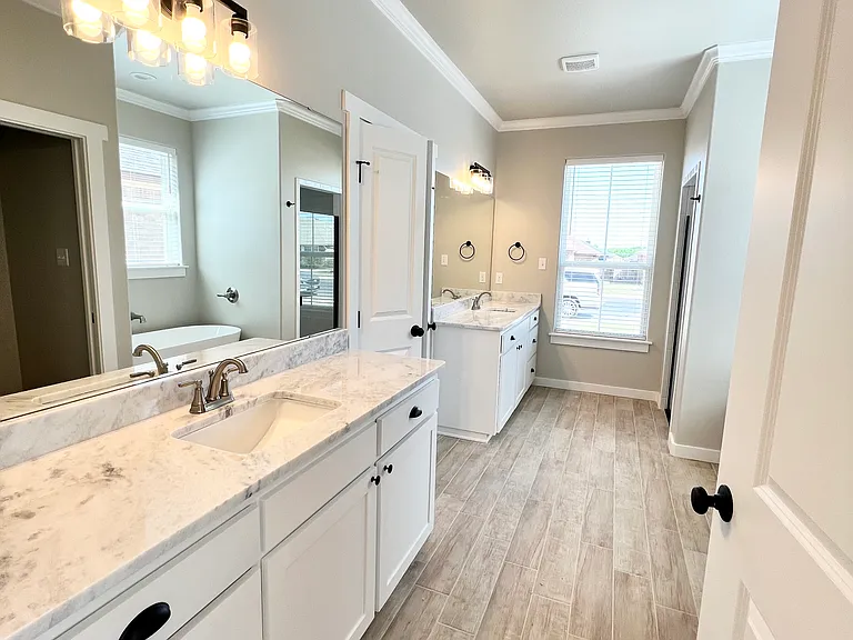 an amazing five piece primary bathroom