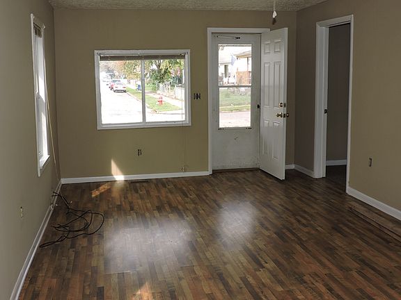 Living room with laminate flooring and plenty of light!