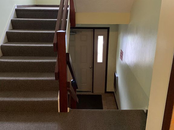 Hallway, stairs leading to apartment