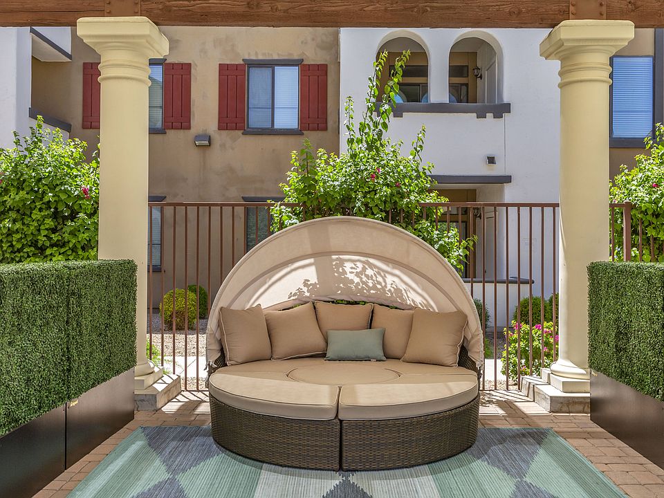 Enjoy our inviting patio, complete with a comfy couch and rug, perfect for unwinding outdoors