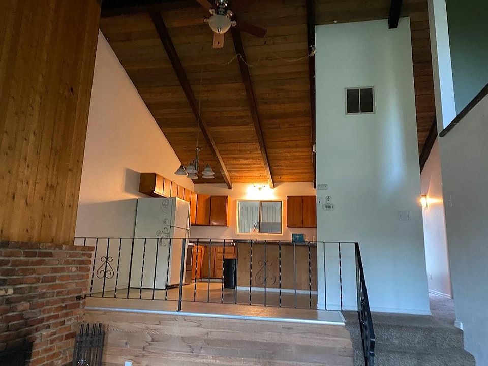 Open main floor - kitchen, dining room into living room with wood burning fireplace.