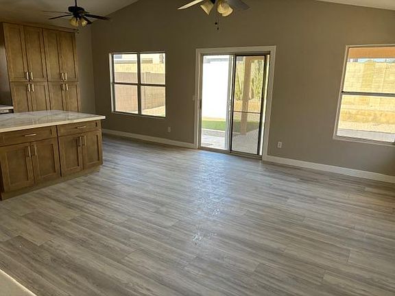 Living Room overlooking kitchen and sliding door to backyard