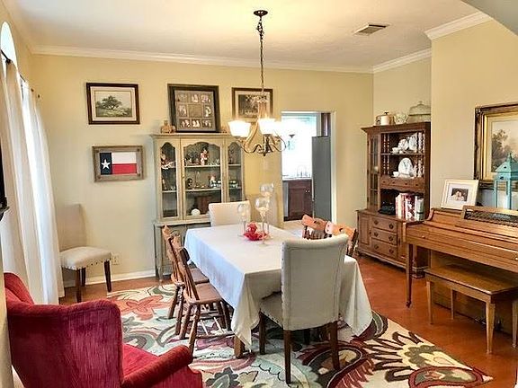 When you enter the home the dining room is to the left and offers wood floors, crown molding, high ceilings and the kitchen is conveniently located off the dining room.