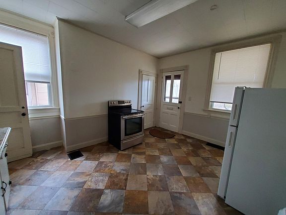 Kitchen, looking at front door.