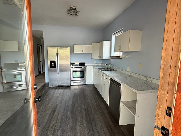 From front door, entry to kitchen
