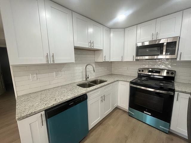 Completely renovated kitchen with shaker front cabinets, stainless appliances and granite counter tops.